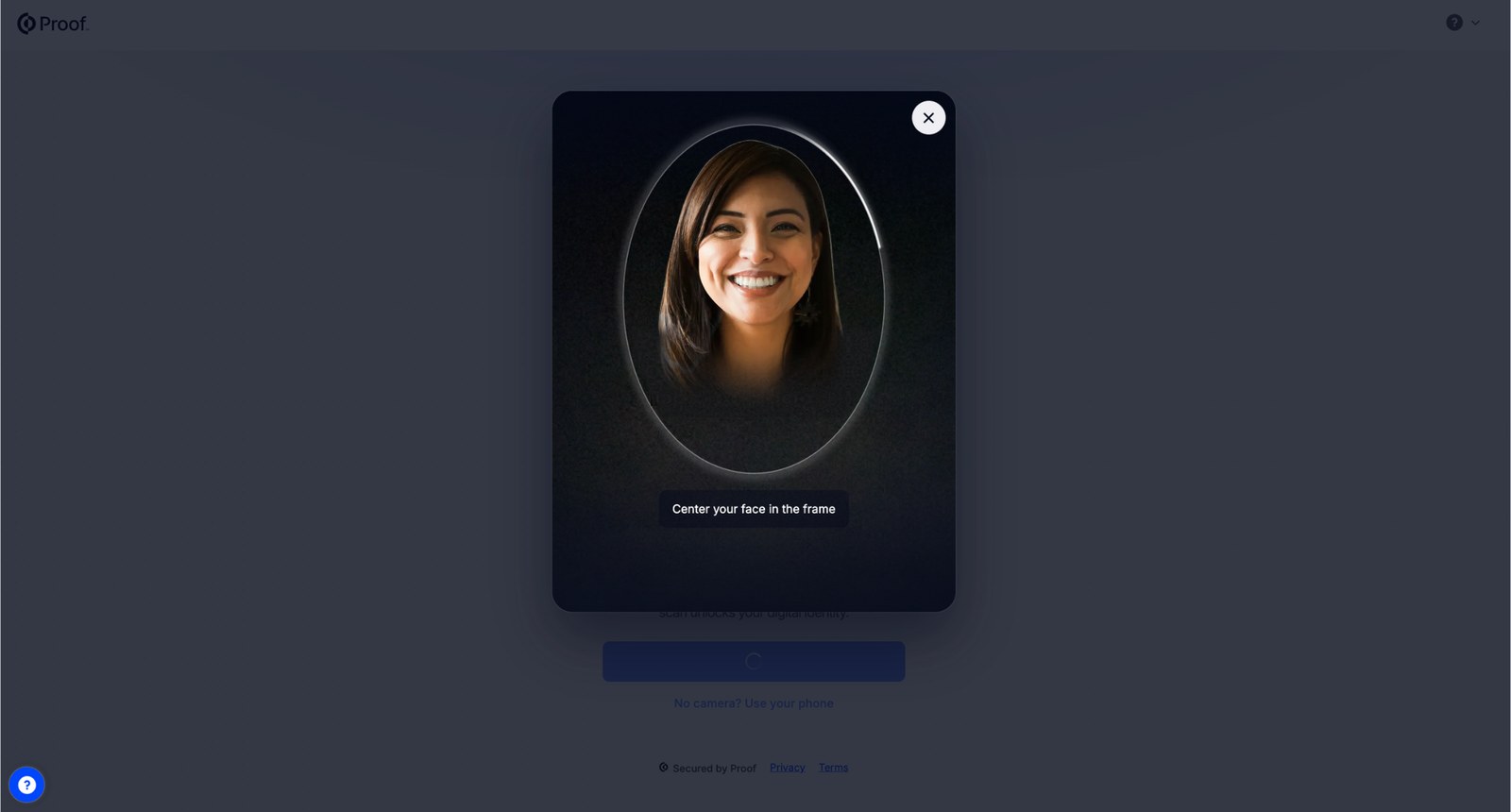 The face scan screen with a face centered in the oval frame and the instruction to center your face in the frame.